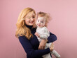 © rubchikova - Happy mother and daughter isolated on pink