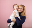 © rubchikova - Happy mother and daughter on a pink background