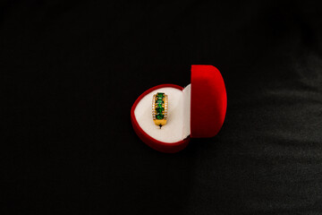 Sticker - Green stoned golden ring in a heart-shaped box