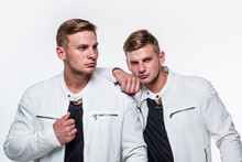 Twin Brothers Men In White Casual Clothes Look Alike, Identically