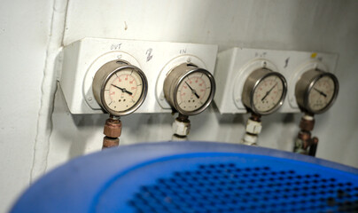 Wall Mural - Pressure gauge psi meter in pipe and valves of water, oil and gas system industry 