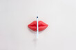 Syringe and plasticine lips. Lip injection creative concept. Beauty secret. Selective focus