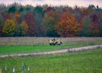 British army Supacat Jackal (MWMIK) rapid assault, fire support and reconnaissance vehicle in action on a military exercise, Salisbury Plain Wiltshire UK