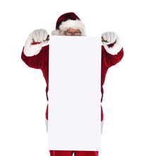 Santa Claus Holding A Blank Scroll In Front Of His Body. Santa Is Looking Over The Top Of The Long Roll Of Paper.
