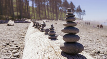 Stacked Stones At The Ocean Beach Create A Sense Of Harmony And Zen