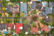 Aerial view of residential houses, gardens and swimming pools on a quiet cul-de-sac in the suburb of Kellyville in Sydney, Australia.