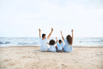 Wall Mural - Happy family on sea beach