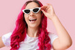 © Pixel-Shot - Beautiful woman with unusual bright hair on color background