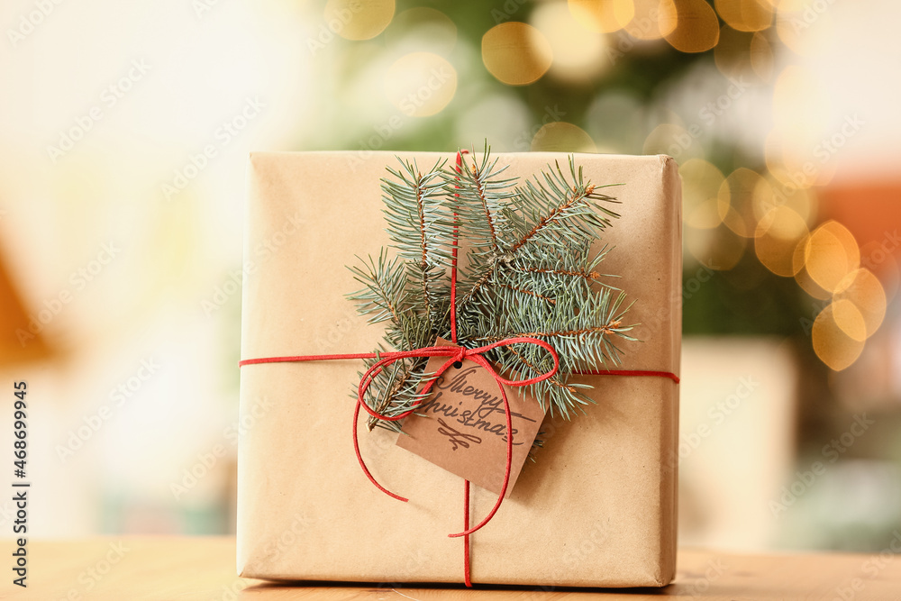 Christmas present on wooden table in room