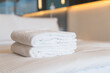 © topntp - white shower towel on bed