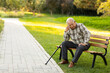 © Blue Jean Images - Lonely senior man sitting on park bench