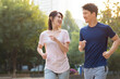 © Blue Jean Images - Happy young couple jogging in park