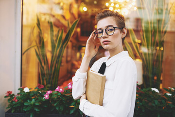 female with glasses reading walk in the fresh air Lifestyle