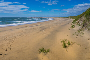 Wall Mural - The beautiful sandy beach of Aguanish on a summer day, located in the Cote Nord region of Quebec, Canada