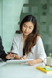 © bongkarn - Portrait picture of a young Asian businesswoman in the meeting.