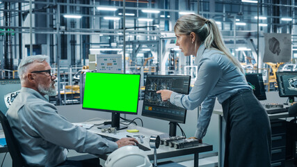 Poster - Car Factory Monitoring Office: Female Project Manager Talks to Male Chief Automotive Engineer Working on Green Screen Chroma Key Computer. Automated Robot Arm Assembly Line Manufacturing Vehicles