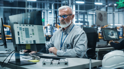 Poster - Car Factory Office: Portrait of Senior Male Chief Engineer Working on Desktop Computer in Automated Robot Arm Assembly Line Manufacturing High-Tech Electric Vehicles. Electronics Production Conveyor