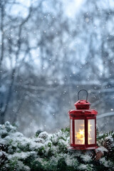 Wall Mural - Christmas lantern and snowy fir tree branches, abstract natural winter background. festive winter season. New Year and Christmas holiday concept. copy space