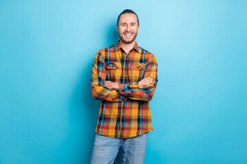 Wall Mural - Photo of boss millennial brunette guy crossed arms wear checkered shirt isolated on blue color background