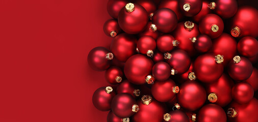 Christmas decorations, top view of pile of glass balls colored in red, isolated on red background, useful as a greeting gift card template