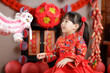 © M-image - young chinese girl with traditional dressing up celebrate Chinese new year