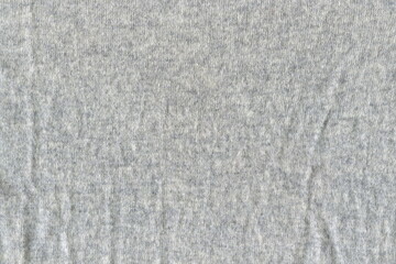 Poster - The texture of a soft textile woolen crumpled, uneven fabric. Soft napkin of gray color, uneven crumpled fabric.