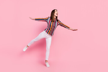 Wall Mural - Photo of sweet pretty young woman dressed colorful blouse smiling flying dancing isolated pink color background