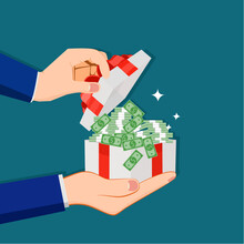A Businessman Opens A Gift Box With A Pile Of Banknotes. Financial Concept