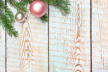Wall Mural - spruce branch with christmas decorations on blue wooden background