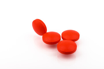 Wall Mural - Red pills on a white background, isolated. Pharmacy. Treatment.