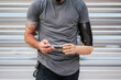 © ADDICTIVE STOCK - Anonymous content man with prosthetic arm using cellphone