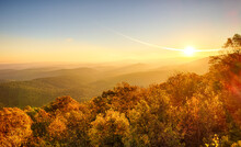 Sunrise In November Over Scenic Mountaintop In Ouachita National Forest, With Fall Colors, Heavy Mist And Fog In Valleys, And Sun Flares
