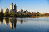 Fototapeta Nowy Jork - Central Park Reservoir or Jacqueline Kennedy Onassis Reservoir in New York city during the autumn season. Beautiful sunny day with warm weather and blue sky.