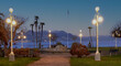 romantic lakeside promenade overlooking the mountains in the light of street lamps Stresa, Lake Maggiore, Italy.