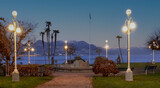 Fototapeta Na drzwi - romantic lakeside promenade overlooking the mountains in the light of street lamps Stresa, Lake Maggiore, Italy.