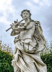 Antique stone statues in the garden of Belvedere Palace, Vienna