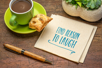 Wall Mural - find reason to laugh - inspirational handwriting on a napkin with a cup of coffee, positive mindset and personal development concept