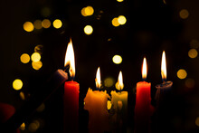 Candlelight Day. Traditional Colombian Holiday. Group Of Candles Lit At Night With Unfocused Lights In The Background.