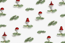Christmas Pattern With Botanical Ornaments Fly Agaric Mushrooms With Red Cap And White Dots, On Natural Green Christmas Fir Tree Branches On White Background. Holiday Winter Decor