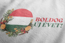 Boldog új évet. Happy New Year. Hungary Flag With Christmas Wreath. Traditional Hungarian Greetings. Design For Postcards, T-shirts, Banners, Greeting Card. Winter Holidays. World Flags. Holiday