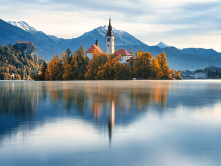 Wall Mural - lake bled in slovenia. church on an island in the middle of the lake. autumn landscape at dawn. larg