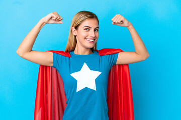 Wall Mural - Blonde woman over isolated background in superhero costume and doing strong gesture