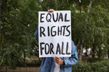 Woman Holding Sign With Text Equal Rights For All Outdoors
