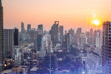 Market Behavior Graph Hologram, Sunset Panoramic City View Of Bangkok, Popular Location To Achieve Financial Degree In Southeast Asia. The Concept Of Financial Data Analysis. Double Exposure.