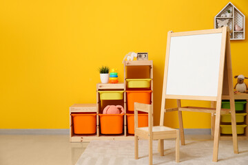 stylish interior of modern children's room with board