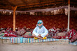 teenager smiling caucasian boy tourist sitting in bedouin house in sand dunes in egypt