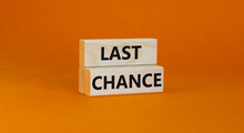 Time To Last Chance Symbol. Concept Words Last Chance On Wooden Blocks On A Beautiful Orange Background. Business And Time To Last Chance Concept. Copy Space.