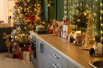 Poster - Kitchen counters with Christmas gifts and decor near green wall