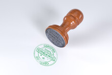 Green Superior Quality Stamp With Wooden Rubber Stamper Isolated On White Background With Text Certified 100% Organic.
