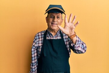 Poster - Handsome senior man with grey hair wearing welding protection mask showing and pointing up with fingers number five while smiling confident and happy.